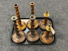 Three pairs of oak barley twist candlesticks