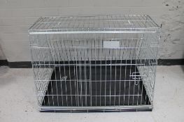 A folding metal dog cage width 97 cm