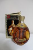 A bottle of John Haig Dimple Deluxe Scotch Whisky 26 2/3 fl. oz.