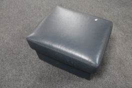 A blue leather storage footstool