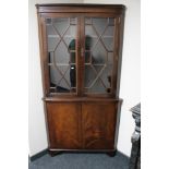 A Regency style corner display cabinet