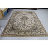 A machine made floral woolen rug on brown ground,