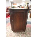 A George III hanging corner cabinet