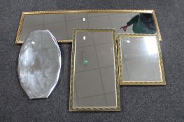 A 1930's frameless bevelled edge mirror together with a gilt framed hall mirror and two further