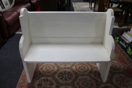 A painted pine pew 98 cm wide, 45 cm deep and 86 cm height.