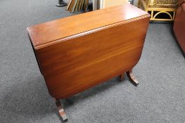 A mahogany drop leaf table CONDITION REPORT: 89cm long by 43cm wide by 76cm high