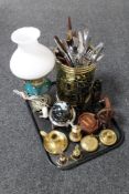 A tray of brass and china electric oil lamp with shade, brass embossed stick pot,