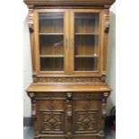 A carved oak Victorian bookcase,