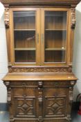 A carved oak Victorian bookcase,