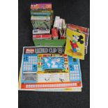 A box of vintage board games, plastic air fix soldiers, mechanical air transport helicopter,