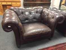 A Barker & Stonehouse brown leather oversized armchair,