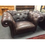 A Barker & Stonehouse brown leather oversized armchair,