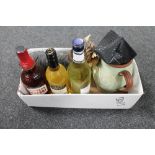 A box of cased Russian 8 x 30 monocular, pottery jug, three bottles of alcohol, Vermouth,