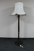 A beech wood standard lamp with shade CONDITION REPORT: Tested and working although