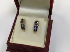 A pair of 10ct gold diamond and sapphire earrings