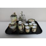 An ornate Japanese porcelain coffee set and a silver plated cruet