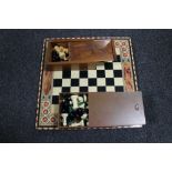 A chess board together with two boxes of chess pieces CONDITION REPORT: Both sets