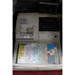 A Samsung SE 7500 cash register with key