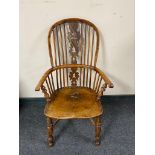 A 19th century elm Windsor armchair,
