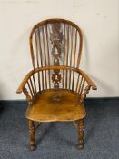 A 19th century elm Windsor armchair,