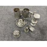 A basket of antique pewter ware - candlestick, snuff box, salt seller,