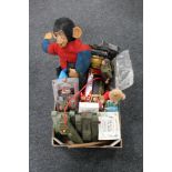 A box of toys, Monkey soft toy, Action man, battery operated tanks,