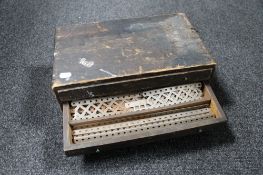 An antique pine three drawer counter topped chest containing vintage Meccano pieces