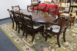 A mahogany Regency style twin pedestal dining table with leaf,