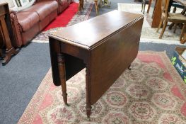 A Victorian mahogany drop leaf table on castors CONDITION REPORT: 106cm long by