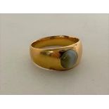 A gold ring with green cabochon stone, marks rubbed, size Q CONDITION REPORT: 6.9g.