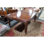 A Victorian mahogany extending dining table fitted with two leaves CONDITION REPORT:
