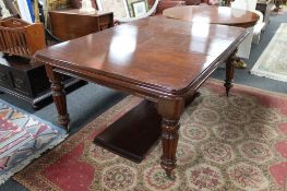 A Victorian mahogany extending dining table fitted with two leaves CONDITION REPORT: