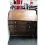 An early Victorian bureau fitted four drawers.