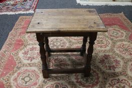 An early 20th century oak stool