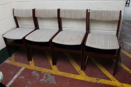 A set of four mid century dining chairs in striped fabric