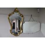 A 1930's frameless mirror together with a decorative gilt framed mirror