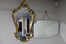 A 1930's frameless mirror together with a decorative gilt framed mirror