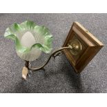An antique brass-armed gas light fitting with green and opaque glass shade (converted)
