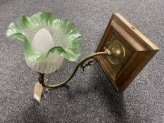 An antique brass-armed gas light fitting with green and opaque glass shade (converted)