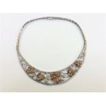 An impressive 18ct white and rose gold diamond set necklace,