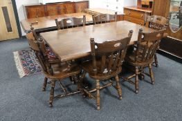 An oak checker board top refectory dining table and six chairs CONDITION REPORT: