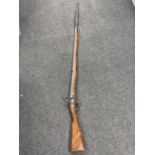 A reproduction long barrelled musket with ramrod and bayonet CONDITION REPORT: