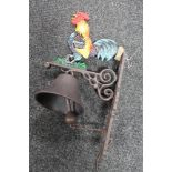 A cast iron cockerel bracket with bell