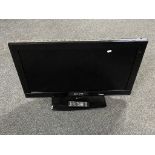 An Akura 32 inch LCD TV with remote