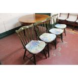 A set of four spindle backed kitchen chairs