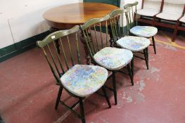 A set of four spindle backed kitchen chairs