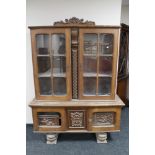 A 20th century continental carved oak display cabinet CONDITION REPORT: Height 184