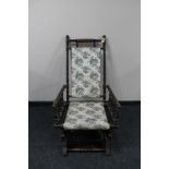 An American rocking chair upholstered in a floral fabric