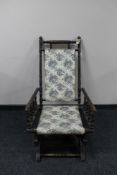 An American rocking chair upholstered in a floral fabric