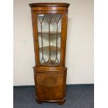 A mahogany corner display cabinet